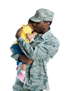 Military soldier dad in uniform holding a child